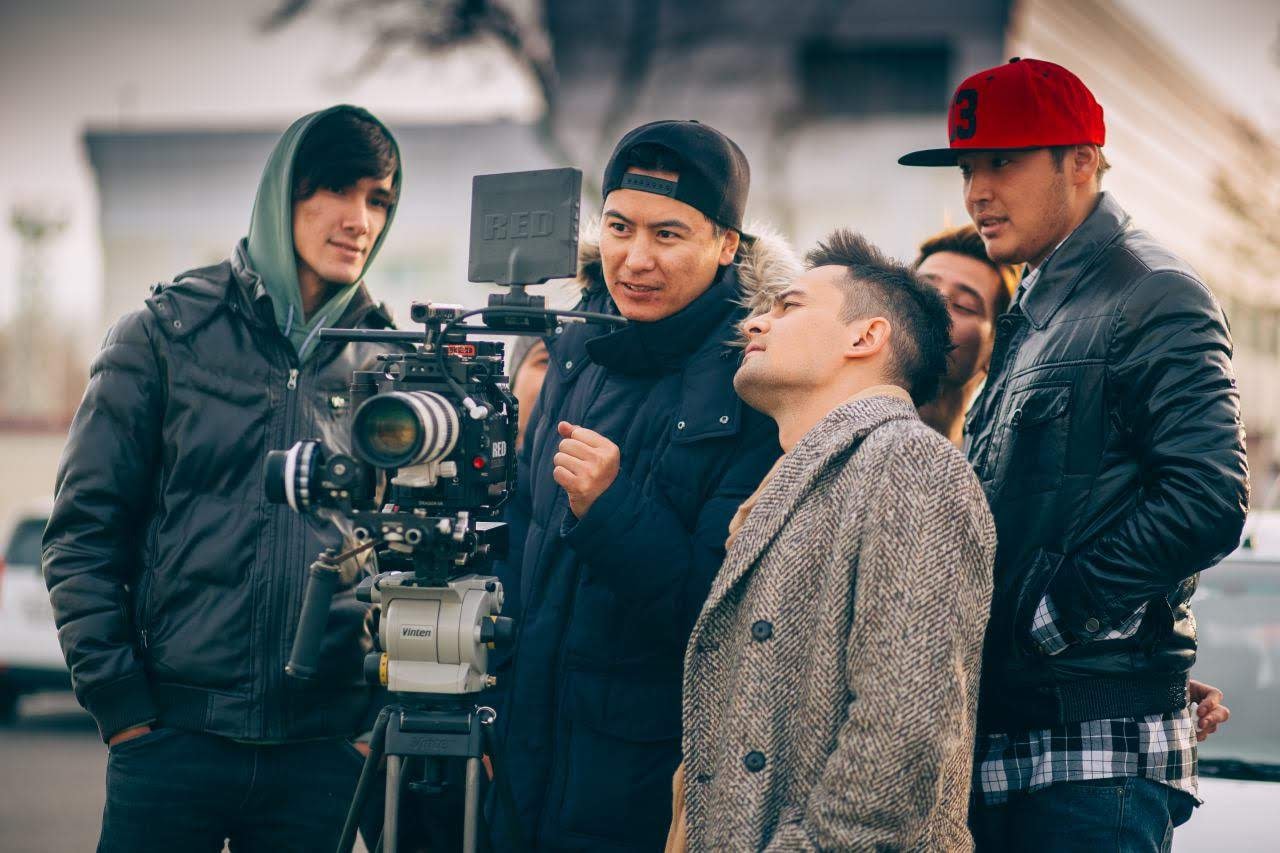 Tim Primkulov directing crew on set with RED camera