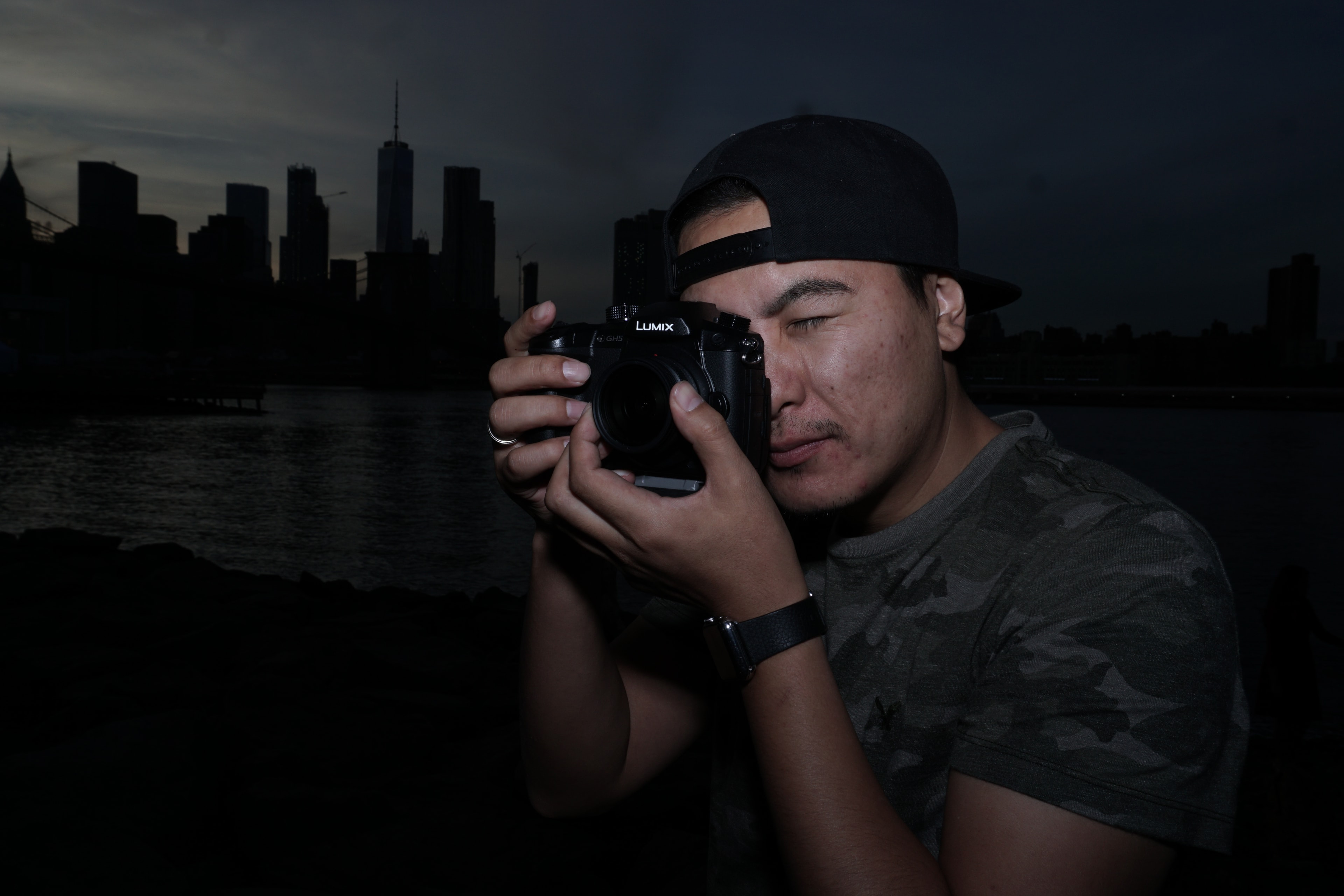 Tim Primkulov shooting with Lumix camera at city skyline
